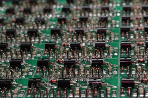 Preview: Close-up side view of a PCB board with SMD components