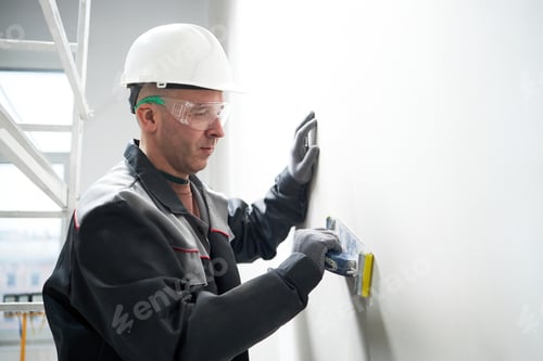 Preview: Caucasian Worker Using Paste to Putty