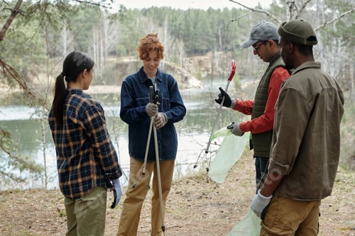 Preview: Diverse Young Adults Collecting Litter Outdoors during Environmental Cleanup