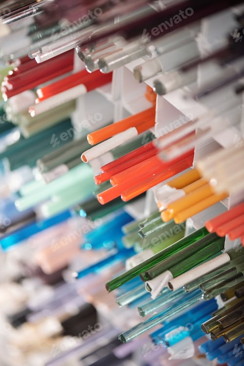Preview: Number of square shelves with long glass multi-color workpieces for lampworking