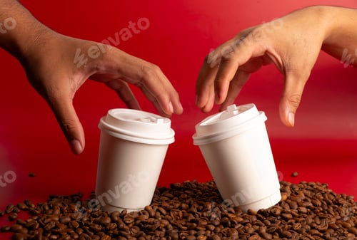 Preview: Hands Reaching for Coffee Cups on Coffee Beans