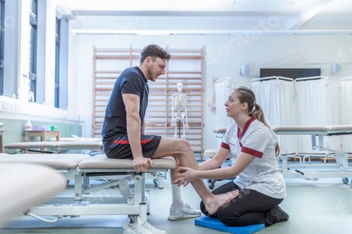 Preview: Physiotherapist with patient in hospital