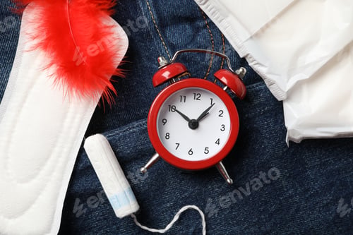 Preview: Menstruation period concept on jeans background, close up