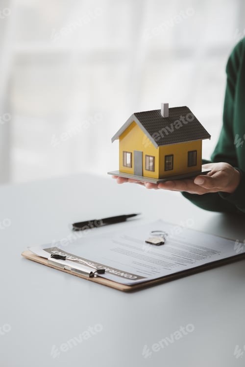 Preview: The salesperson of the housing estate in the project is preparing and verifying the contract of sale