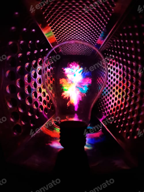 Preview: Closeup of a transparent lightbulb with colorful reflections inside the grater