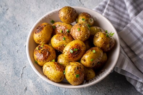 Preview: Roasted baked baby potatoes with garlic and herbs.