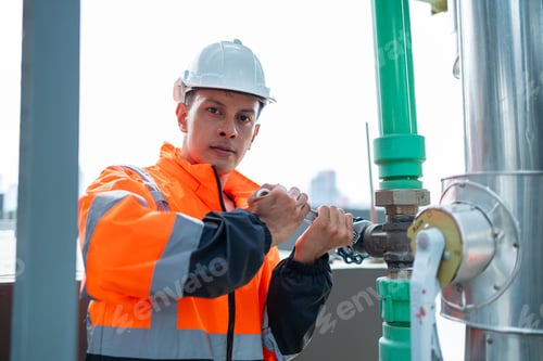 Preview: The engineer checks and adjusts the valve to allow the amount of water to flow through