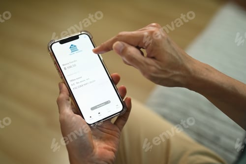 Preview: Closeup view man using banking app on smartphone for contactless payment and accounting