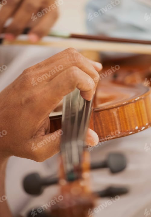 Preview: Diverse unrecognizable musician plays violin