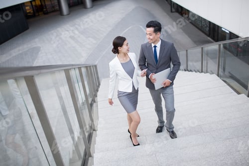 Preview: Business person talking on the stairs