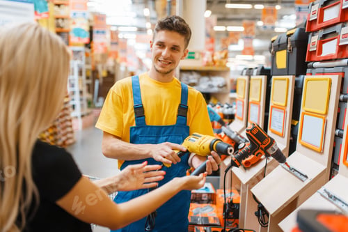 Preview: Consultant and female consumer in hardware store