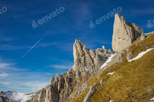 Preview: Majestic Rocky Peaks Under Blue Sky