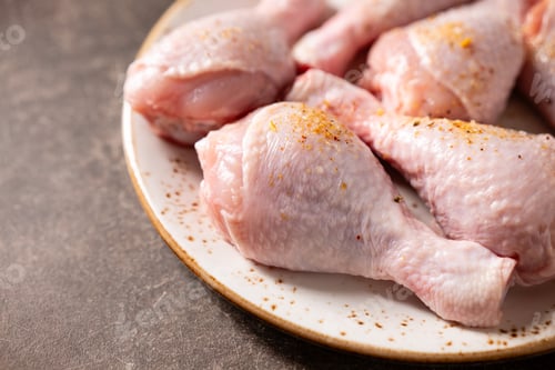 Preview: Raw Chicken Drumsticks with Seasoning on Plate