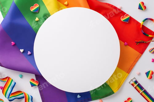 Preview: A bird's-eye top view of LGBT parade symbolic accessories, such as wristlet, rainbow flag