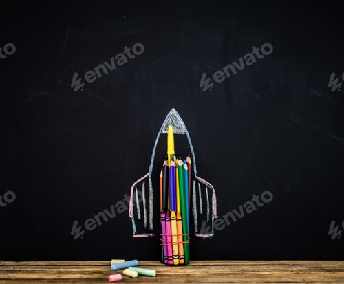 Preview: Back to school black background the missile made with pencils, drawing crayons books