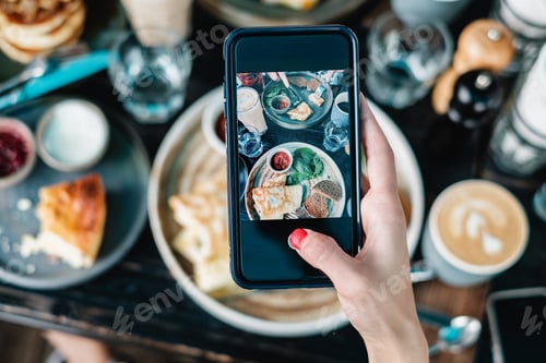 Woman Taking Food Photo at Brunch Table