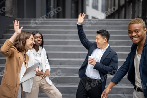 Preview: Business people giving five each other in city