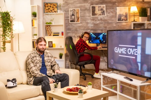 Preview: Stressed and angry male gamer losing a game