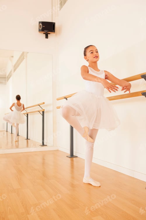 Preview: Flexible ballerina exercising in dance studio