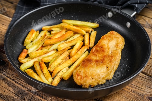 Preview: English Traditional Fish and chips dish in a pan. Wooden background. Top view