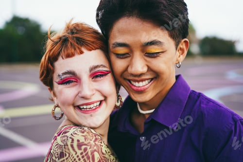 Preview: Young diverse friends having fun outdoor - Focus on gay asian guy wearing make-up