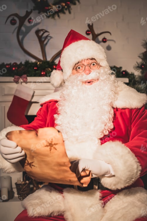 Preview: surprised santa holding parchment with wishlist and looking at camera