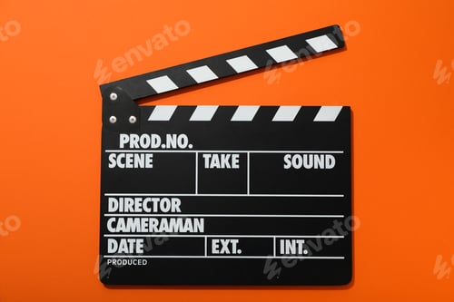 Preview: Clapperboard for filming on orange background, top view