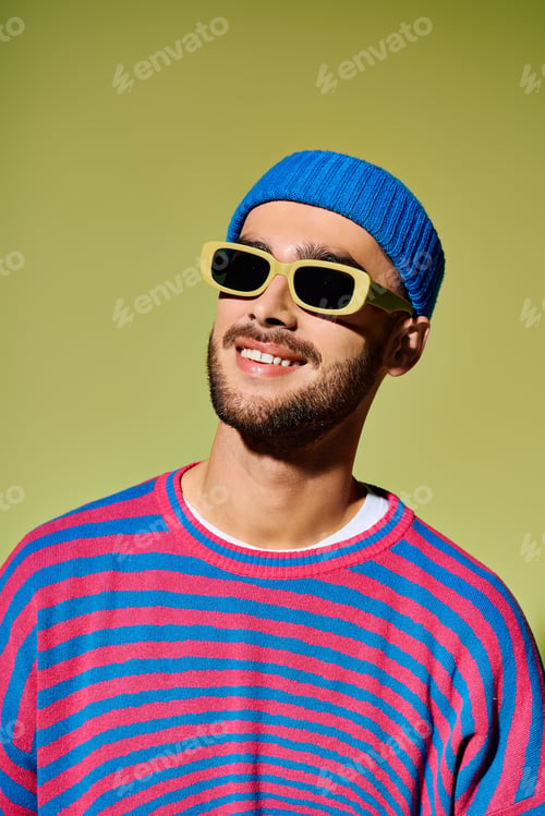 Preview: Showcasing vibrant fashion with a trendy young man in a stylish studio setting
