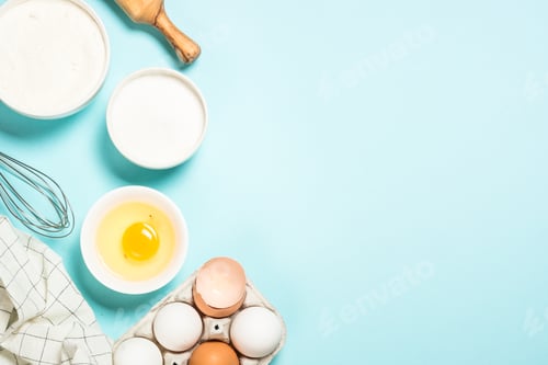 Preview: Baking ingredients at blue table top view.