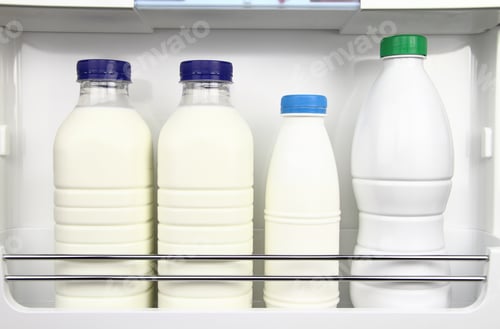 Preview: Various bottles of milk in the fridge