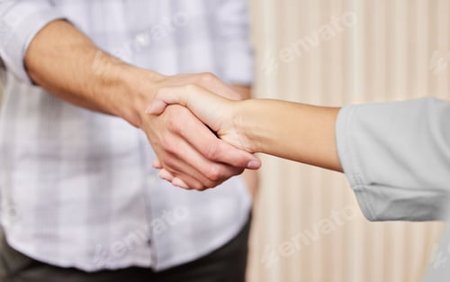 Preview: Cropped shot of two unrecognizable businesspeople shaking hands while standing in an office