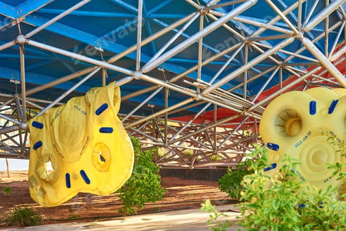 Preview: Damaged yellow inflatable float in the water park