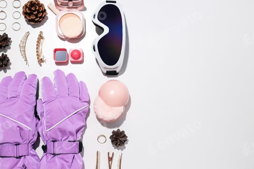 Preview: Warm winter clothes with accessories on a light background