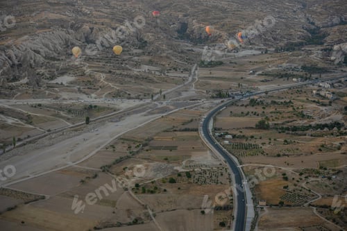 Preview: Hot air balloons rising into the sky during sunrise. Travel concept.