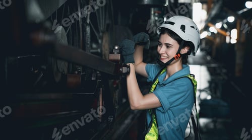 Preview: Industrial engineers inspect and perform maintenance on the machines at factory machines.