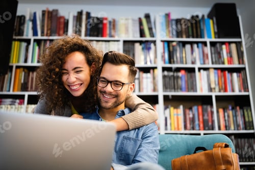 Preview: Students are studying together in library. Couple, study, technology, education love concept