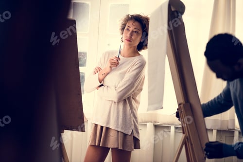 Preview: Woman working on painting