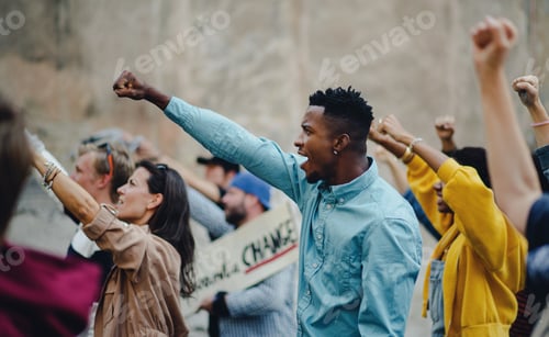 Preview: Group of people activists with raised fists protesting on streets, BLM demonstration concept.