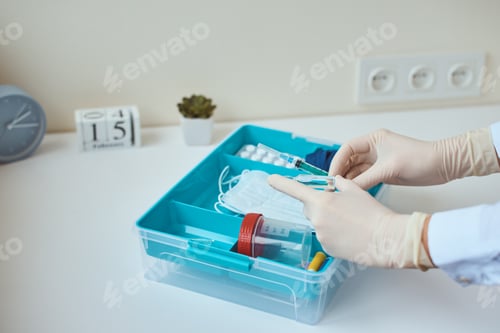 Preview: First aid kit close up. Home medicine box with a medical items. Healthcare and medicine concept