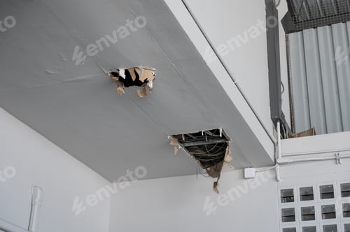 Preview: Ceiling panel damaged and crack hole with wire system from water leakage
