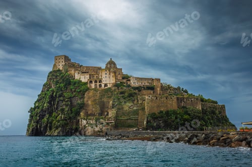 Preview: Ischia, Italy with Aragonese Castle in the Mediterranean at dusk