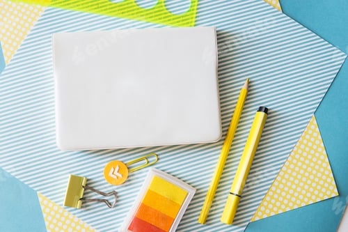 Preview: School supplies. Yellow and blue colors. Empty notebook. Flat lay composition. Space for text.