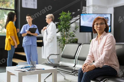 Preview: Portrait of relaxed asian person waiting in the medical clinic lobby