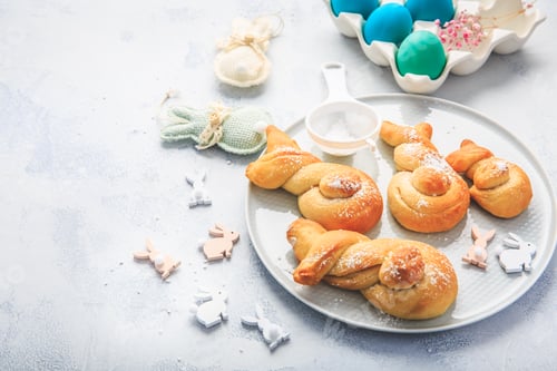 Preview: Traditional sweet Easter buns with colorful eggs for a brunch