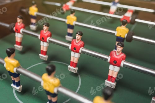Preview: Closeup of a table football figures under the lights with a blurry background