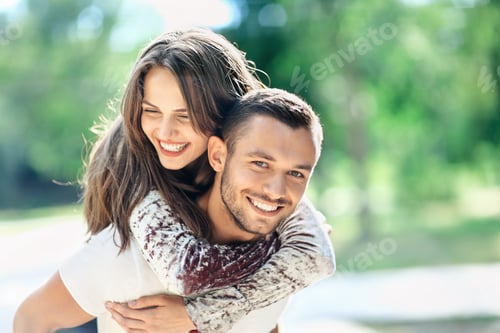 Preview: Outdoors portrait of lovers happy young man and woman