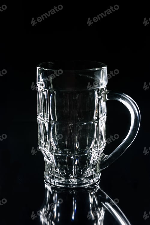 Preview: one beer glass on black reflecting surface