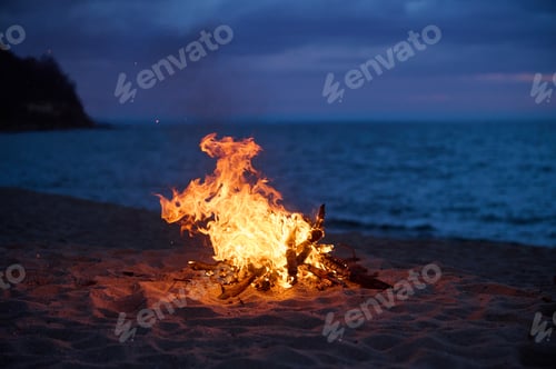 Preview: Beach Bonfire selective focus with Beautiful Sunset or sunrise nobody