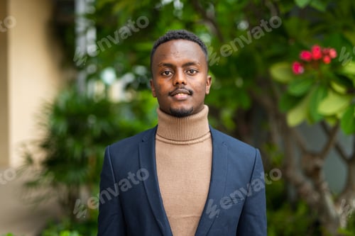 Preview: Portrait of young handsome black businessman