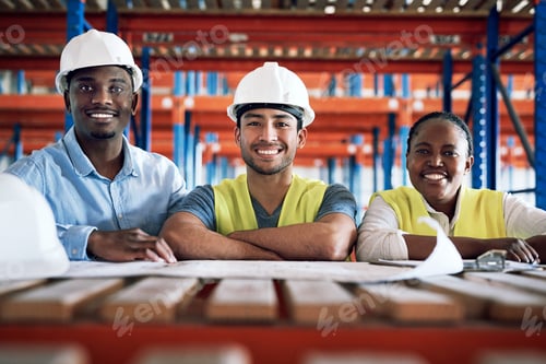 Preview: Shot of a group of builders having a meeting at a construction site